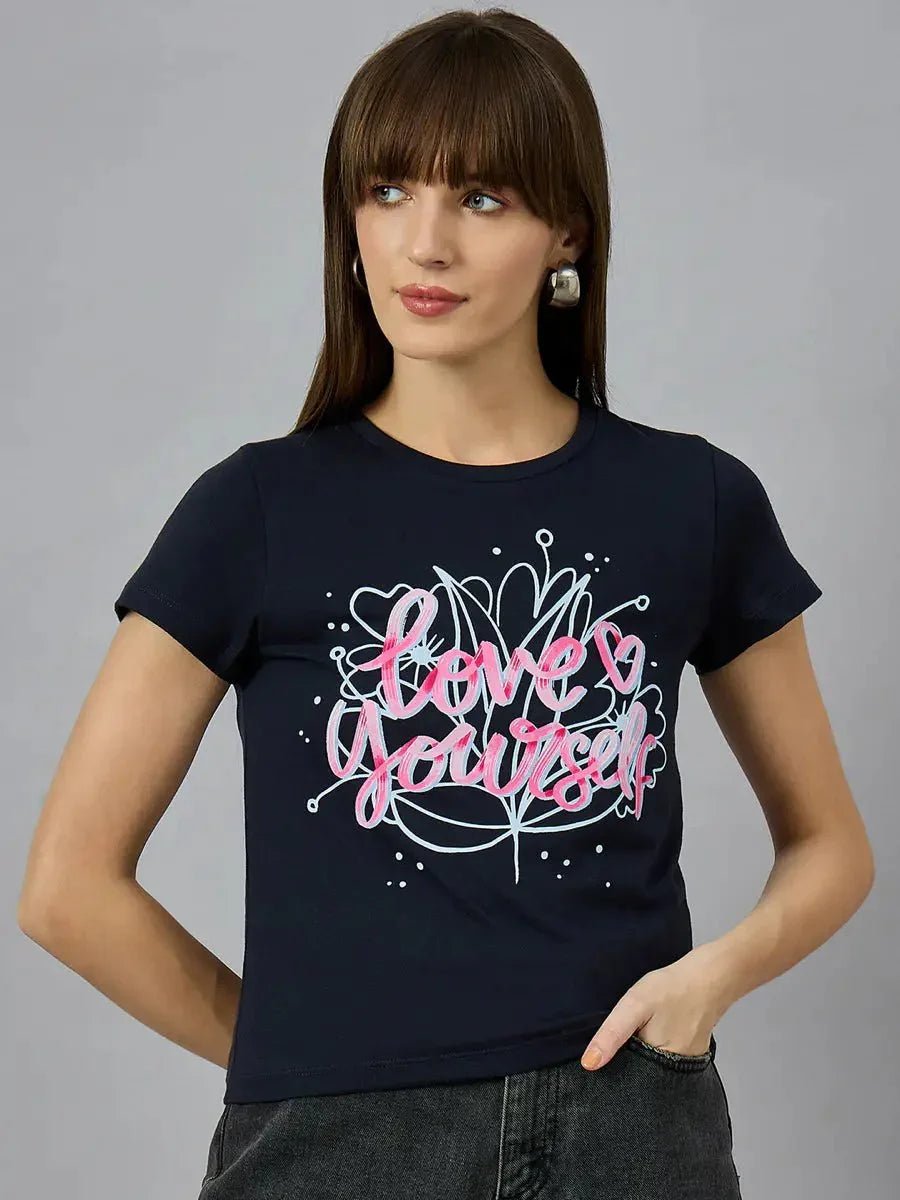Woman with straight brown hair in 98degreenorths navy cotton typography tee with Love Yourself and heart graphics.