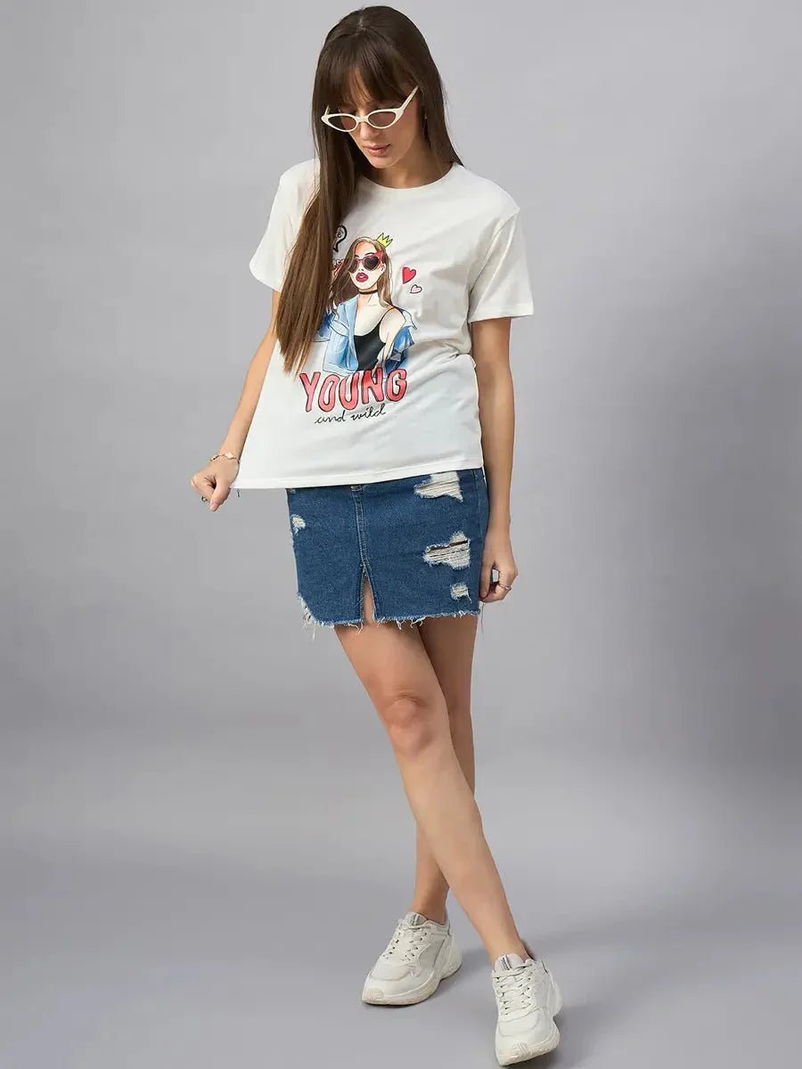 Woman wears 98degreenorth Casual Streetwear Cotton Typography T-shirt in a relaxed fit, styled with a denim skirt and sneakers.