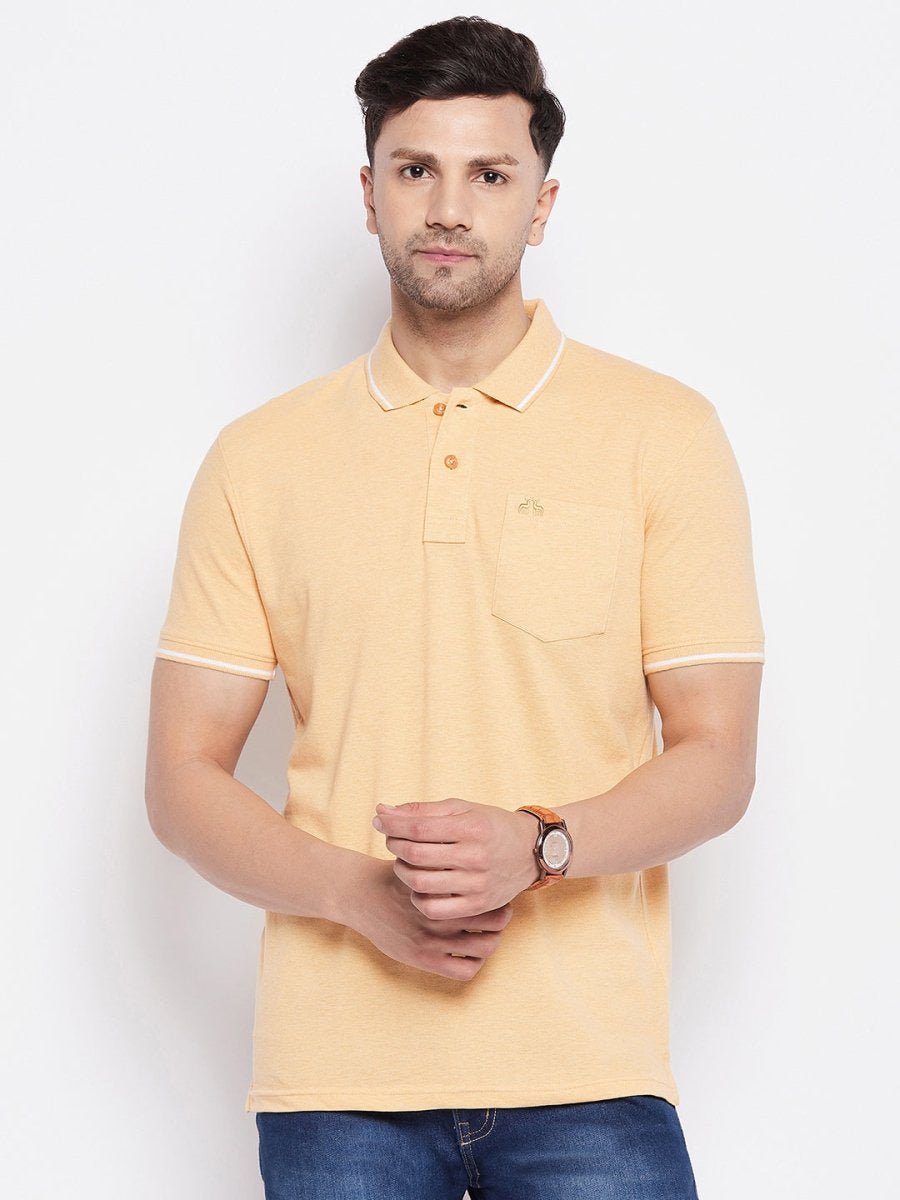 Man wearing a Men Yellow Polo Collar T-shirt by 98degreenorth, blue jeans, and a watch against a white background.