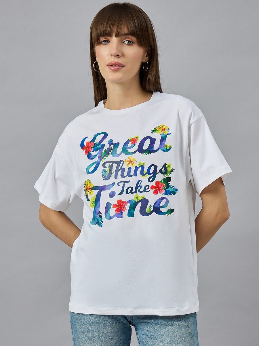 Woman in 98degreenorth Urban Streetwear Typography T-shirt with colorful floral Great Things Take Time text.