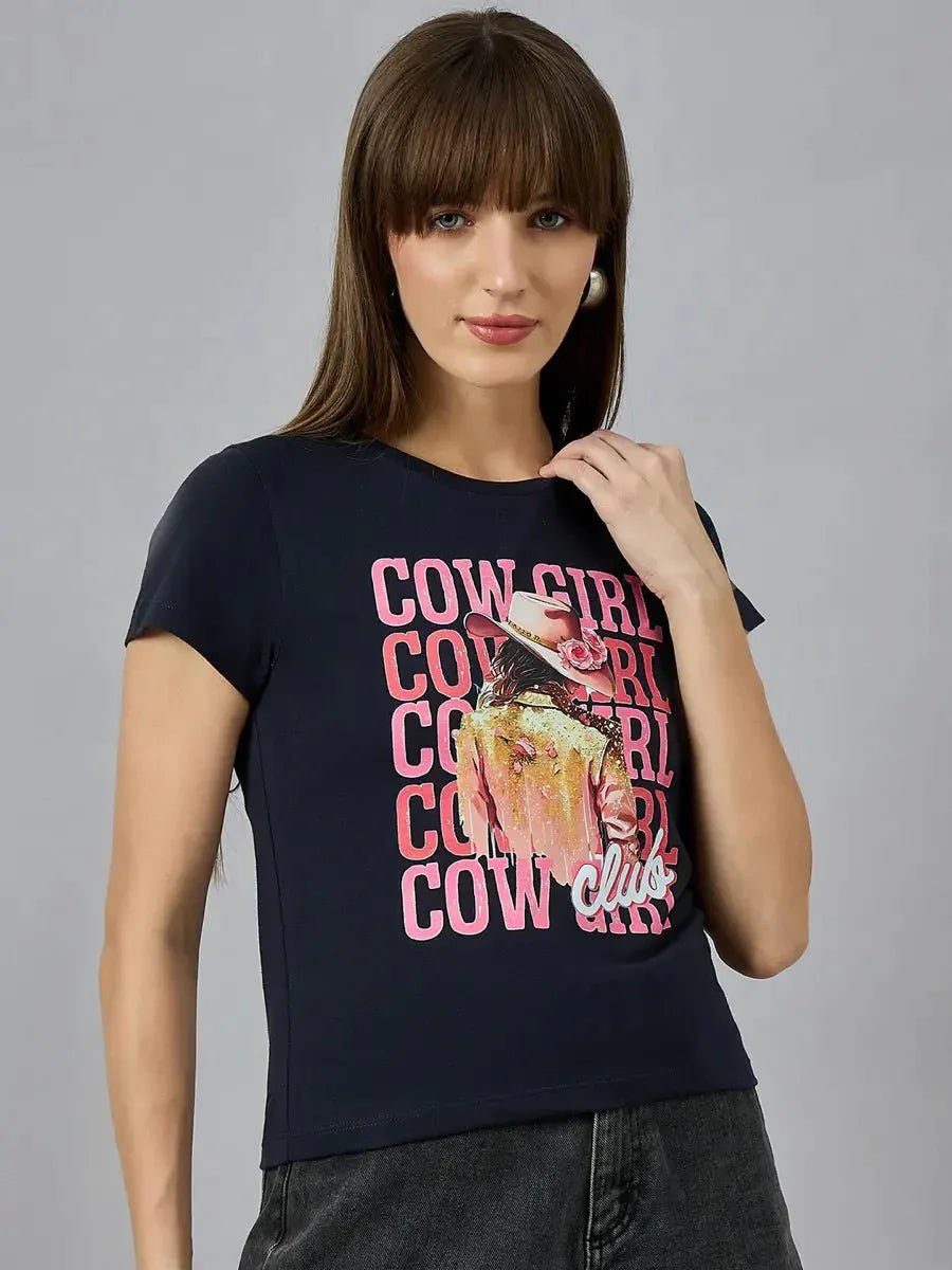 Woman with straight brown hair wears a navy 98degreenorth women’s cotton typography t-shirt and black jeans.