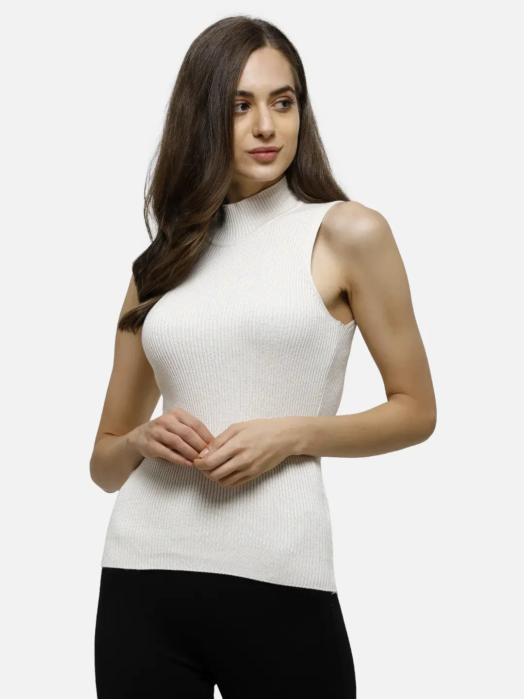 Woman wearing 98degreenorth Off-White Ribbed High Neck Sleeveless Knit Top with black pants, posing against a plain backdrop.