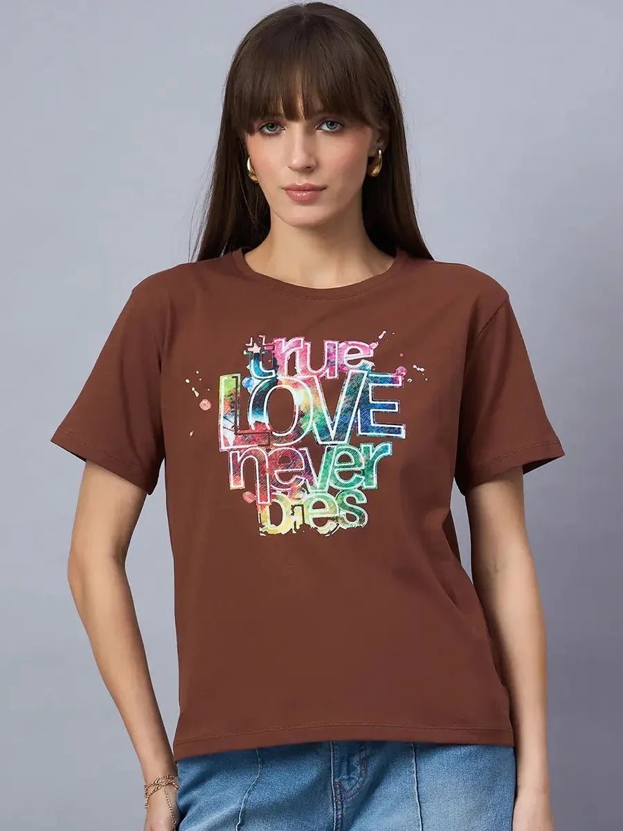 Woman in a 98degreenorth Women’s Typography Graphic Print Cotton Tee, featuring vibrant LOVE never dies text.