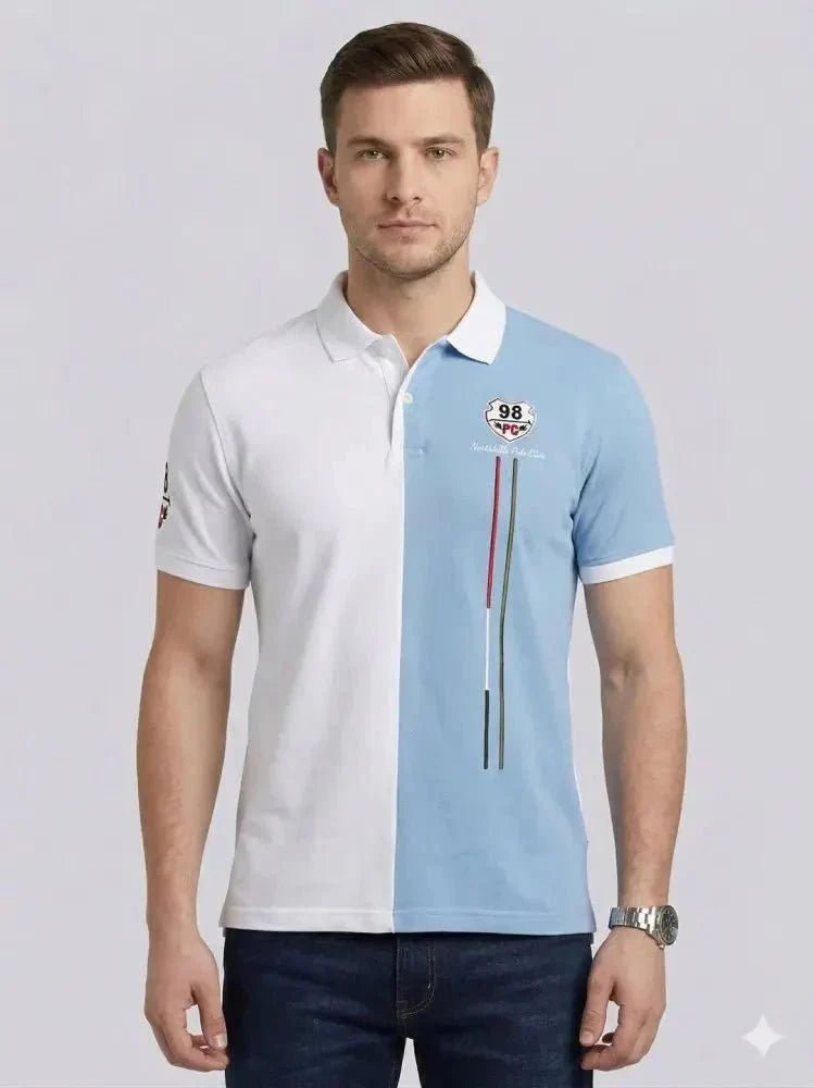 A man wearing a black long-sleeve polo shirt with a chest pocket and blue jeans stands against a plain white background, looking straight ahead.