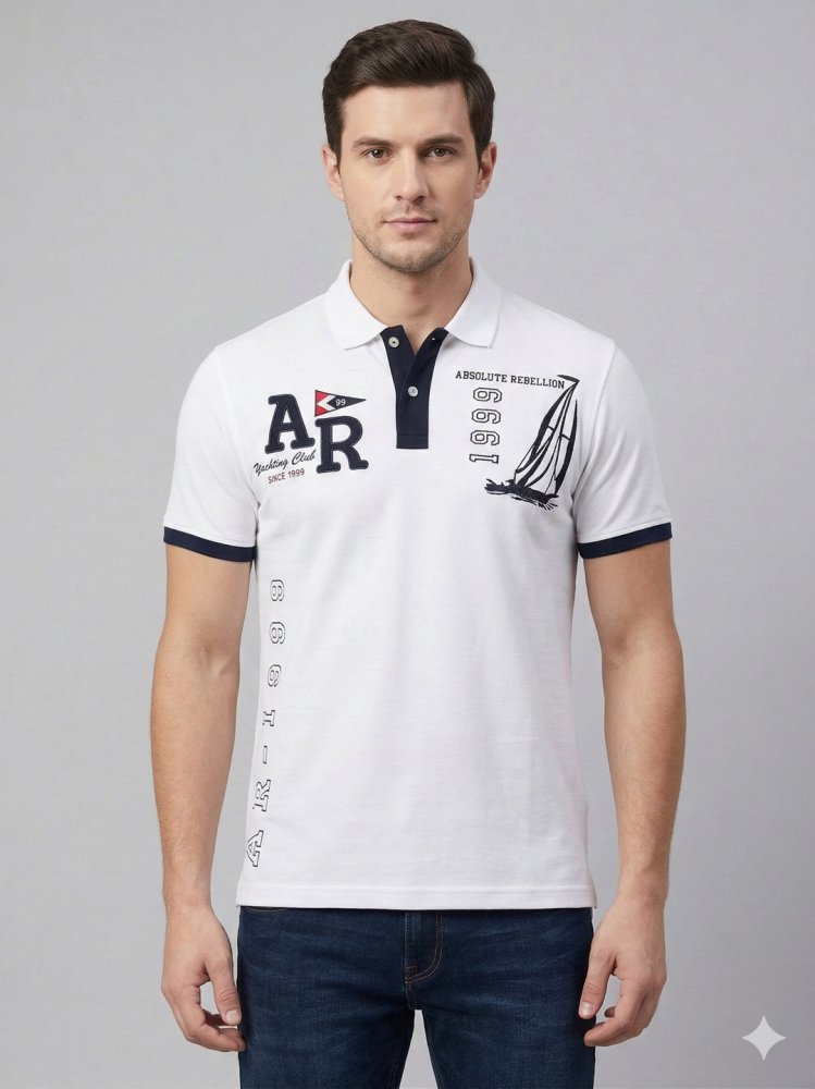 Man wearing a mustard brown short-sleeve polo shirt and light blue jeans, standing against a plain white background, looking to his left with one hand by his side.