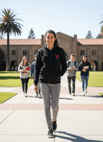 A student wears the 98degreenorth Women’s Fleece Zipper Black Hoodie Sweatshirt while walking on campus.