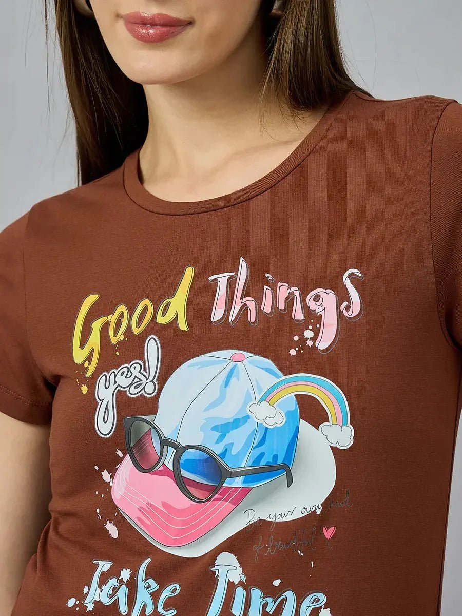 Woman in a 98degreenorth breathable cotton tee with typography print, perfect for streetwear-inspired everyday looks.