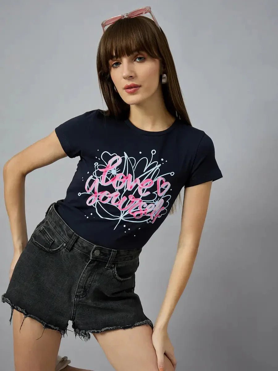 Woman wears a 98degreenorth must-have cotton typography t-shirt, perfect with denims, shorts, or joggers.
