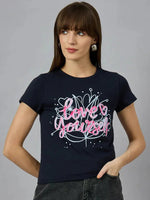 Woman with straight brown hair in 98degreenorths navy cotton typography tee with Love Yourself and heart graphics.