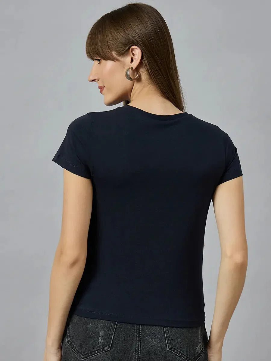 Woman in a stretchable cotton typography t-shirt by 98degreenorth, styled casually and shown from the back.