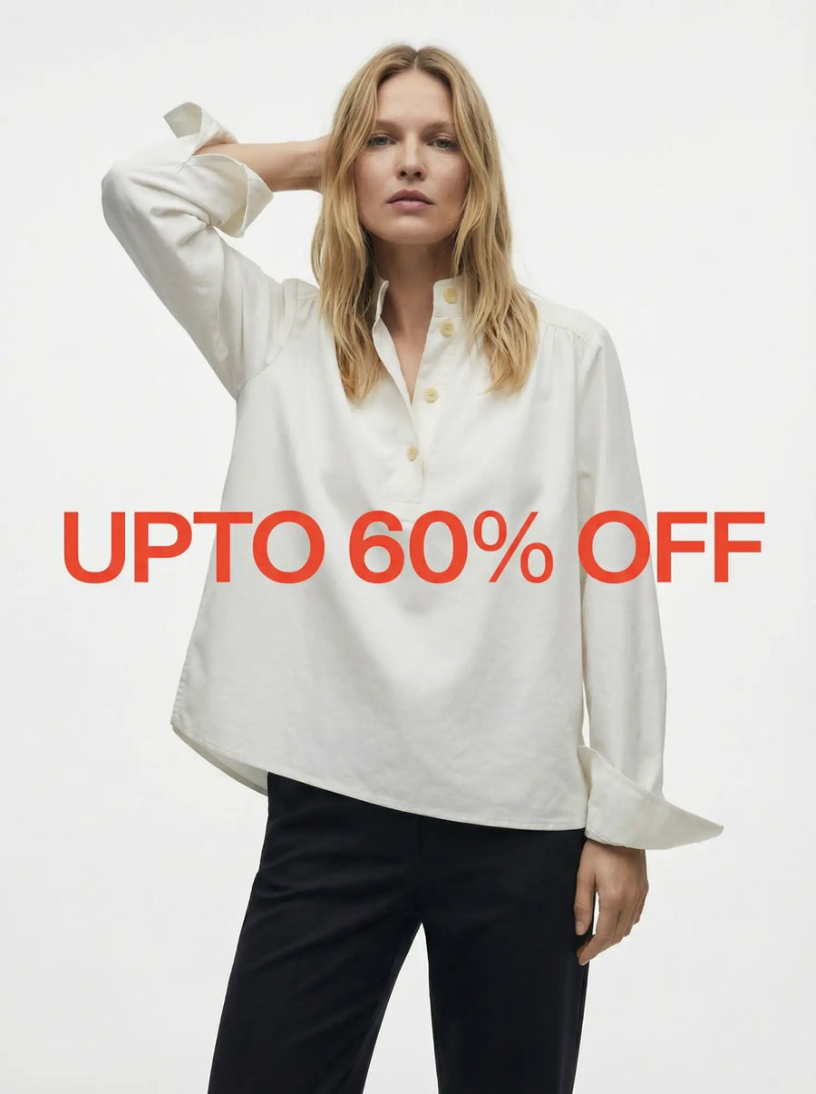 Woman in a white blouse and black pants with UPTO 60% OFF text in bold red letters across the image.