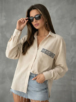 Woman in Beige Aztec Embroidered Pocket Cotton Shirt by 98degreenorth, paired with a frayed denim skirt.