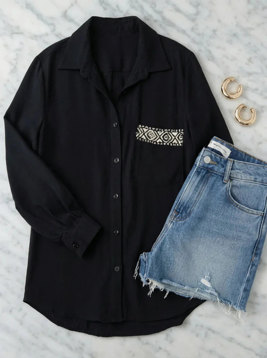 Black Aztec Embroidered Pocket Cotton Shirt by 98degreenorth styled with denim shorts and gold hoop earrings.