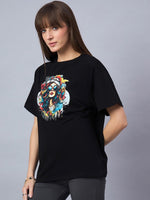 Model wears 98degreenorth Black Typography Printed Oversized Cotton T-shirt with round neck, drop shoulder style.