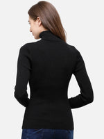 Woman with long brown hair wears 98degreenorth Black Women’s Ribbed Stretchable Turtleneck Sweater, facing away.