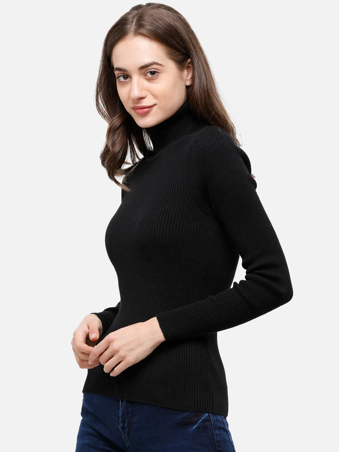 Woman in a 98degreenorth black ribbed turtleneck slim-fit sweater and blue jeans, smiling against a plain background.