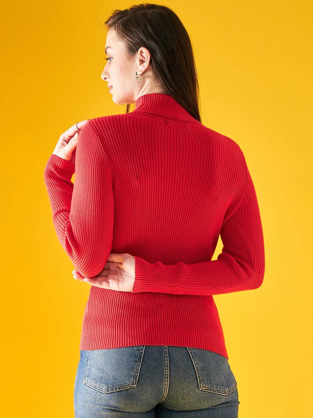 A woman models the 98degreenorth Bright Red Ribbed Turtleneck Sweater, a slim fit pullover for Indian winters.