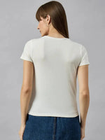 Woman in a 98degreenorth casual cotton typography t-shirt with a relaxed streetwear vibe faces away from the camera.
