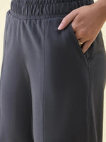 Close-up of 98degreenorth Charcoal Wide Leg Pintuck Trackpants from Luxe Lounge, made with soft French Terry Lycra.