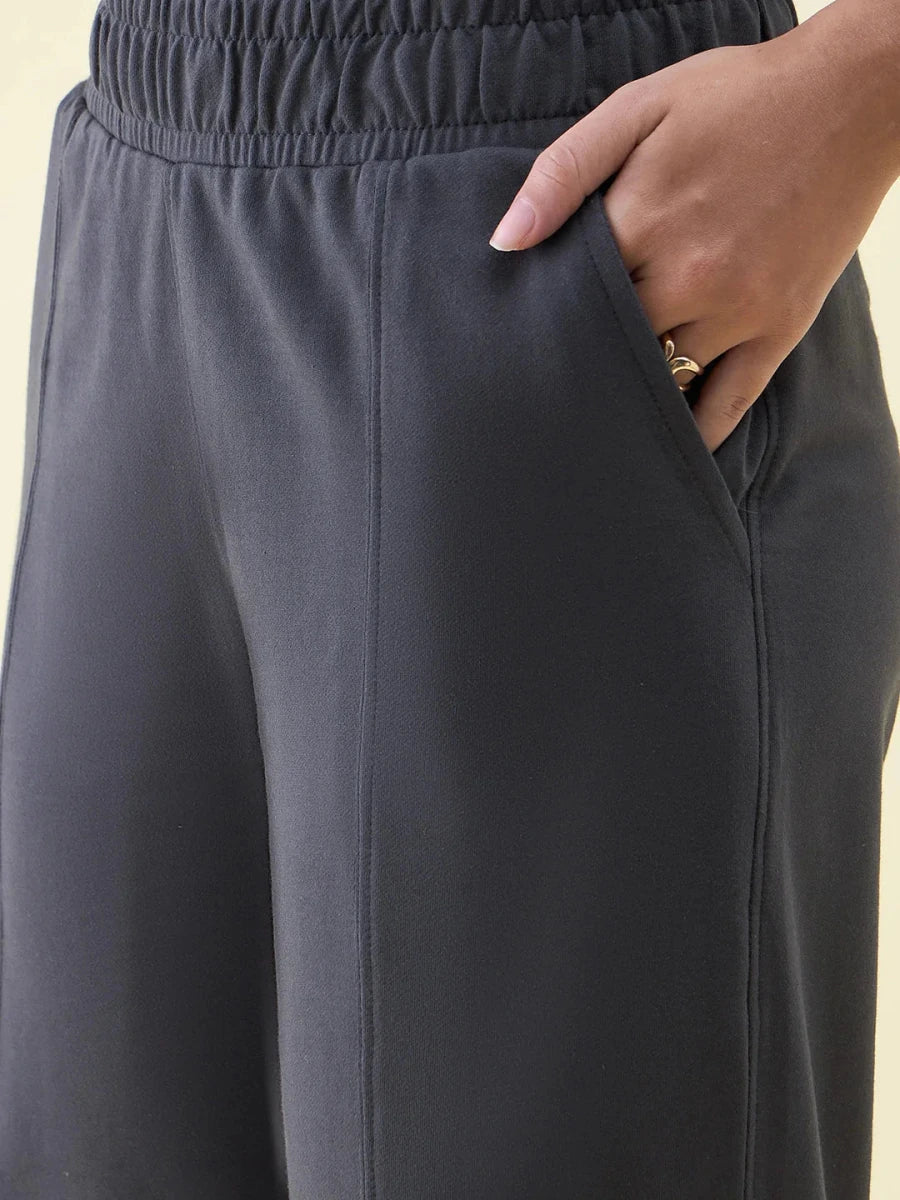 Close-up of 98degreenorth Charcoal Wide Leg Pintuck Trackpants from Luxe Lounge, made with soft French Terry Lycra.