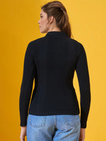 Woman wears 98degreenorth’s Classic Black Women’s Ribbed Polo-Neck Knit Top, facing away against a yellow background.