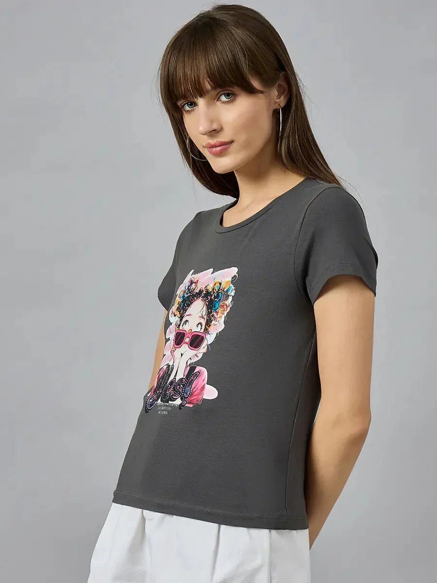 Woman wearing 98degreenorth classic round-neck cotton typography t-shirt, styled with a white skirt, posing sideways.