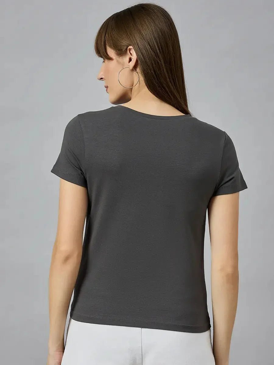 A woman with long brown hair wears a 98degreenorth classic round-neck typography cotton t-shirt, shown from the back.
