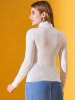 Woman in 98degreenorth Classic White Ribbed Stretchable Turtleneck Sweater, facing away against a yellow background.