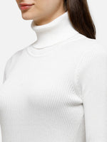 Woman wearing the 98degreenorth Classic White Ribbed Turtle Neck Sweater—stretch fit winter knit top for work & casual wear.