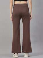 A model wears 98degreenorth Cocoa Brown Women's Fleece Flared Sweatpants, shown from the back against a grey backdrop.
