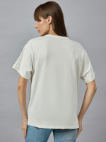 Woman models 98degreenorths Everyday Cotton Typography Print Tee, round neck street style, with blue jeans on gray backdrop.