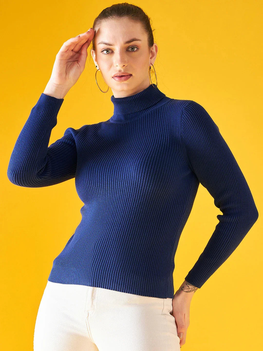 A woman models the 98degreenorth Indigo Ribbed Knit Turtleneck Sweater—slim fit, stretchy, perfect for winter comfort.