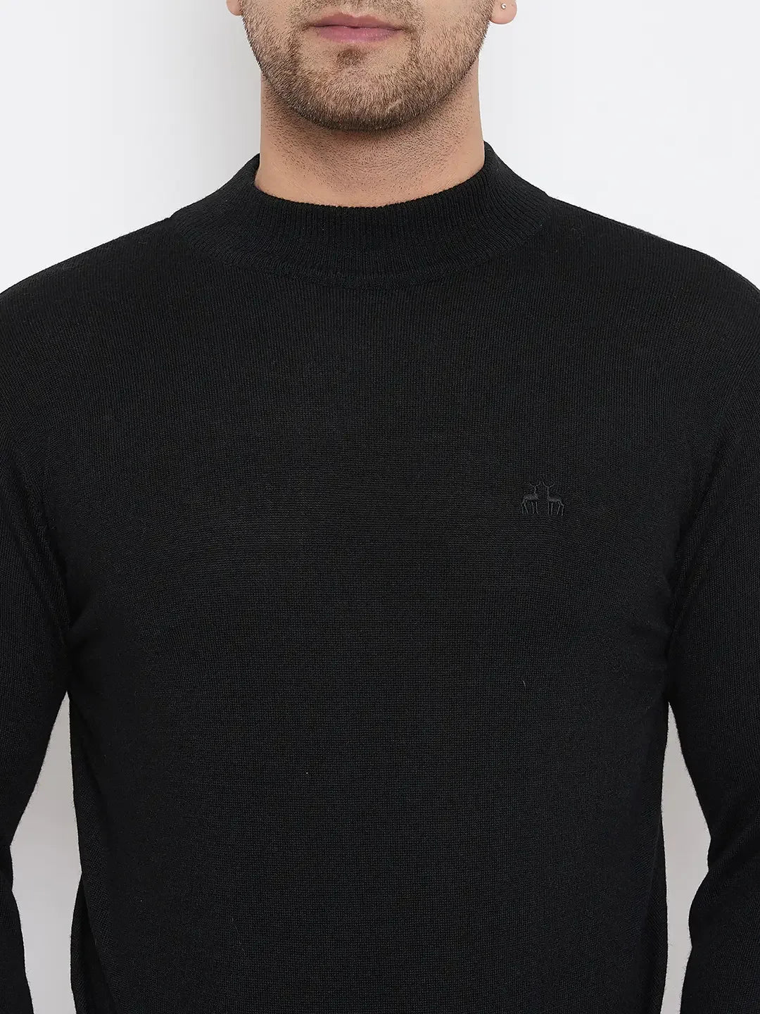 A man models the 98degreenorth Men Merino Wool Black Turtleneck Pullover, shown from shoulders to just above the lips, against a white background.