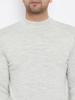 A man models the 98degreenorth Men Merino Wool Ecru Turtleneck Pullover, featuring a soft wool blend and a small embroidered crown logo on the left chest, against a plain white background. His face is partially visible.
