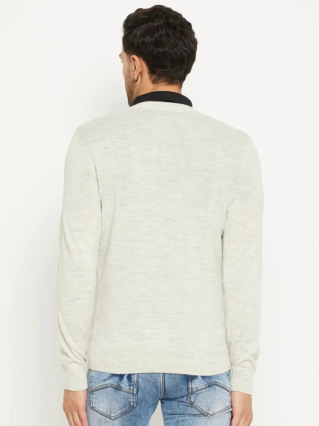 Man in 98degreenorth Men Merino Wool Ecru V-Neck Pullover and blue jeans, back to camera, on white background.