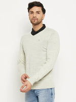 Man in 98degreenorth Men Merino Wool Ecru V-Neck Pullover over a black shirt, paired with blue jeans.