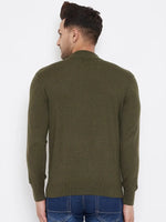 A man in blue jeans and a 98degreenorth Men Merino Wool Olive Turtleneck Pullover stands facing away from the camera against a plain white background.