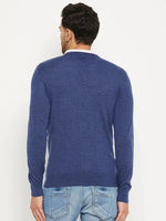 Man in 98degreenorth Men Merino Wool V-Neck Pullover—Light Denim, with light blue jeans, back to camera.
