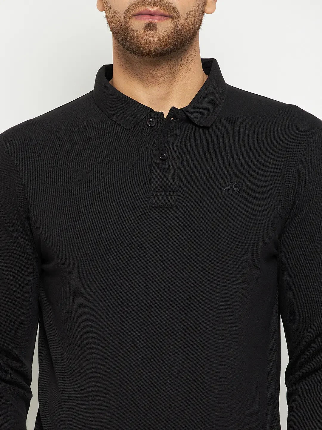 Man wearing 98degreenorth Men Polo Collar Full Sleeves Black T-shirt with a small embroidered logo on the left chest.