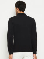 A man in a 98degreenorth Men Polo Collar Full Sleeves Black T-shirt and white pants, shown from the back.