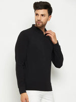Man wearing a 98degreenorth Men Polo Collar Full Sleeves Black T-shirt and white pants, against a plain white background.