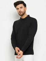 Man in a 98degreenorth Men Polo Collar Full Sleeves Black T-shirt and white pants stands against a plain white background.