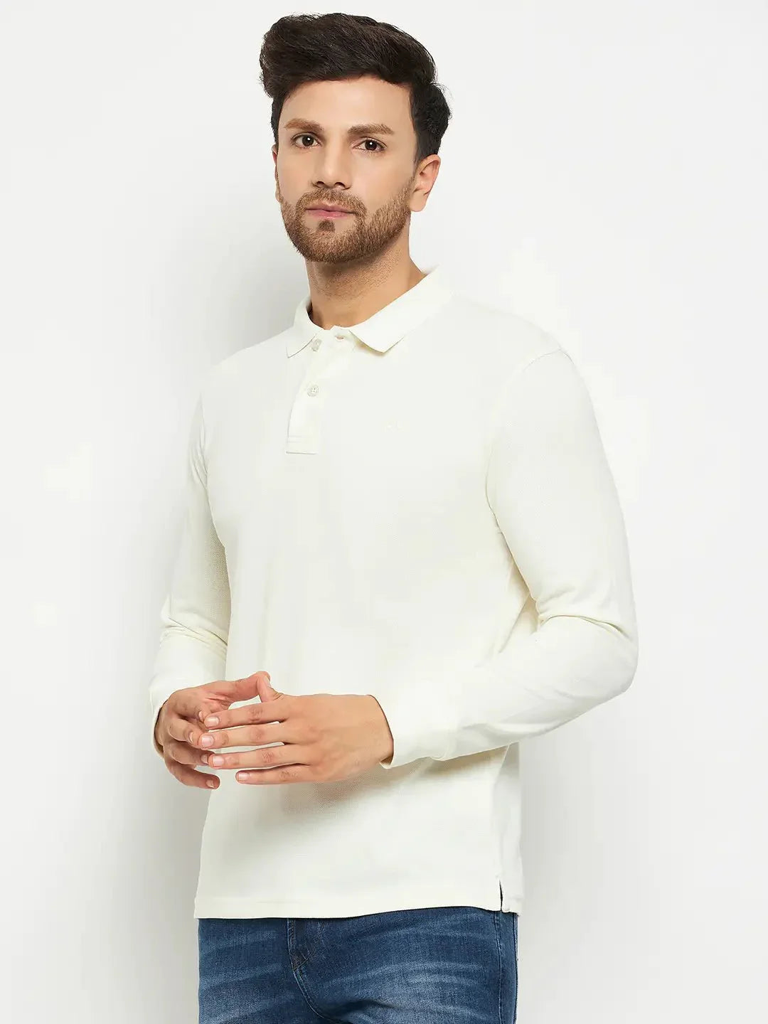 Man in 98degreenorth Men Polo Collar Full Sleeves Butter T-shirt and blue jeans against a white background.
