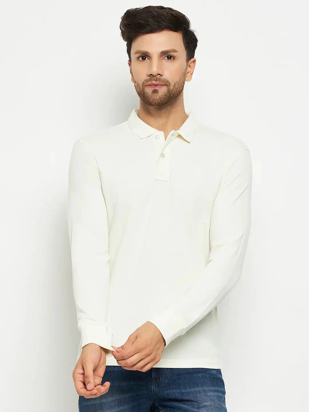 Man wearing a 98degreenorth Men Polo Collar Full Sleeves Butter T-shirt and blue jeans against a white background.