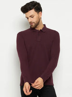 Man in a 98degreenorth Men Polo Collar Full Sleeves Dark Wine T-shirt and black pants, touching his sleeve.