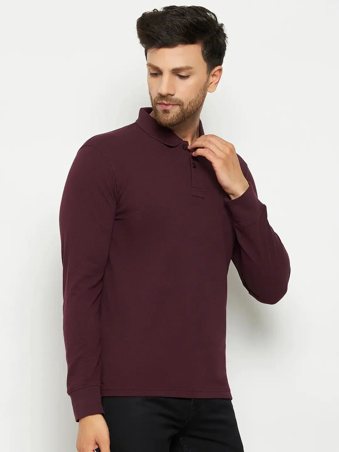 Man wearing 98degreenorth Men Polo Collar Full Sleeves Dark Wine T-shirt, looking down touching his collar.