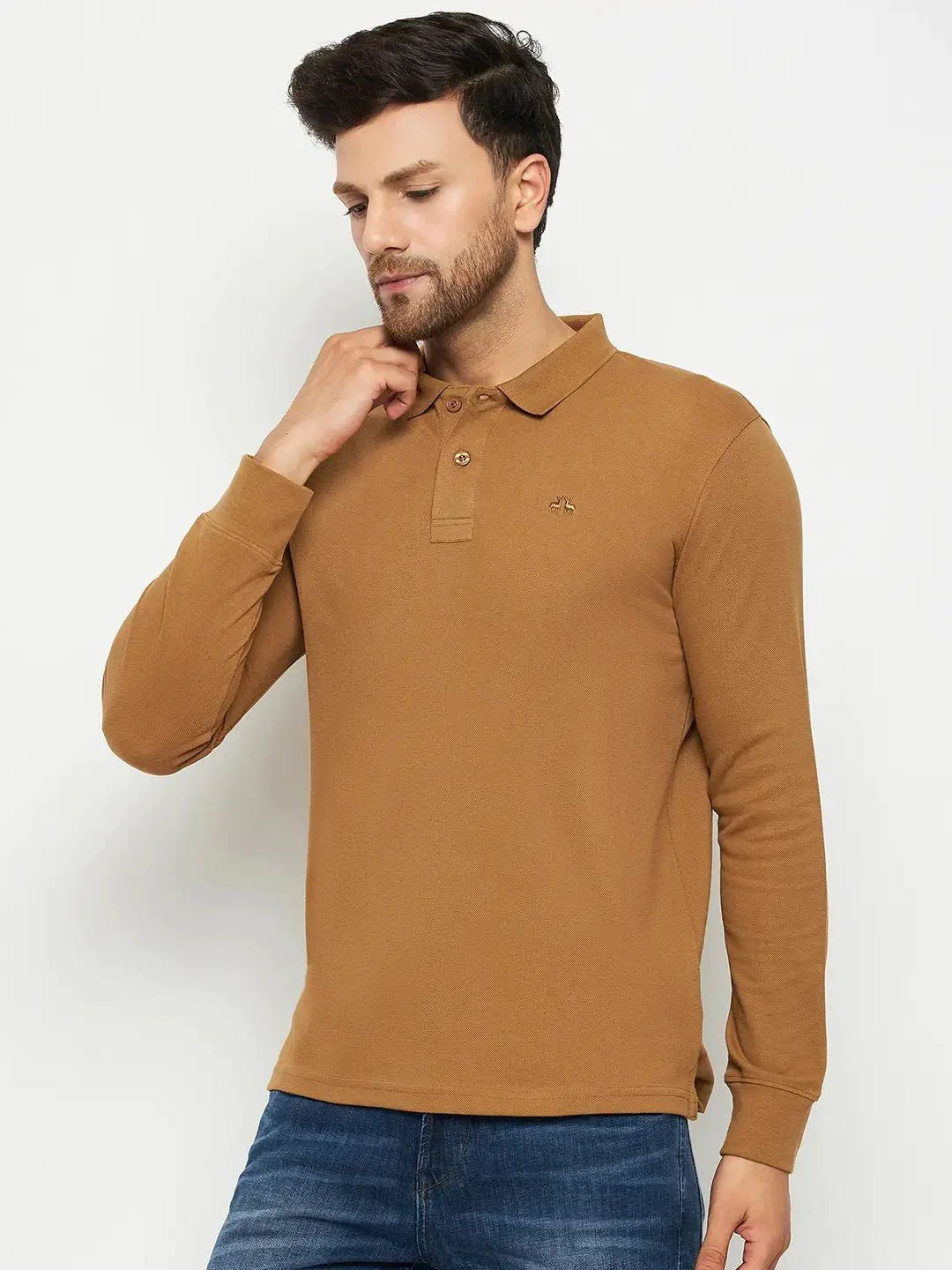Man wears 98degreenorth Men Polo Collar Full Sleeves Khakhi T-shirt with blue jeans, against a white background.