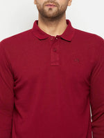 A man wears a 98degreenorth Men Polo Collar Full Sleeves Maroon T-shirt, set against a plain background.