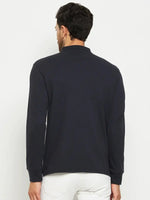Man wears 98degreenorth Men Polo Collar Full Sleeves Navy T-shirt, a stylish pick for travel wardrobes.