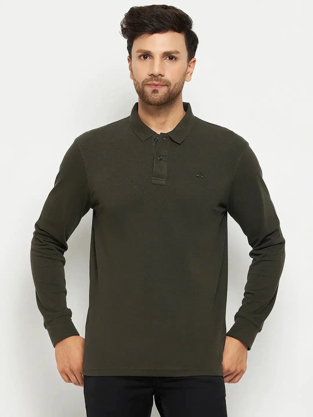 Man in an olive Men Polo Collar Full Sleeves T-shirt by 98degreenorth and black pants, on a plain white background.
